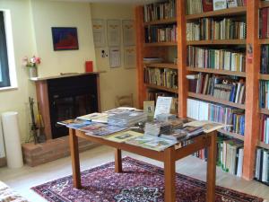 a library with a table with books on it at Abruzzo Segreto in Navelli
