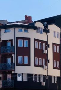 an apartment building with windows on the side of it at Casa di VaLL City Apartments in Ohrid
