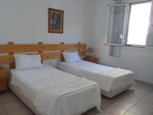 Кровать или кровати в номере Villa Pachino