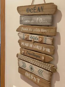 a stack of books hanging on a wall at Refúgio do Clérigo in Aljezur