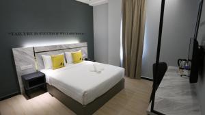 Postel nebo postele na pokoji v ubytování Hotel 99 Sepang KLIA & KLIA2 + 28 fotografií