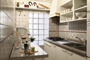 Kuchyň nebo kuchyňský kout v ubytování Casa Nina