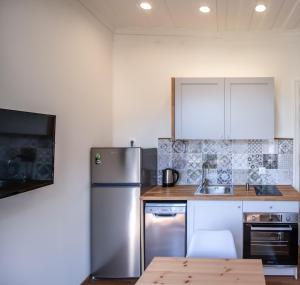 A kitchen or kitchenette at Levkosh Apartments at Lefkada's Heart