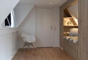 Säng eller sängar i ett rum på Sfeervol vakantiehuis in Holwerd