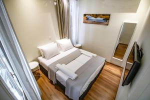 A bed or beds in a room at Levkosh Apartments at Lefkada's Heart