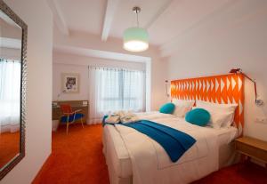 Ένα ή περισσότερα κρεβάτια σε δωμάτιο στο Piccolo Grand Hotel