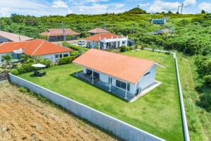 an aerial view of a house with an orange roof at Sunset Hill Ishigaki in Ishigaki Island