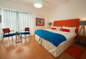 Ένα ή περισσότερα κρεβάτια σε δωμάτιο στο Piccolo Grand Hotel
