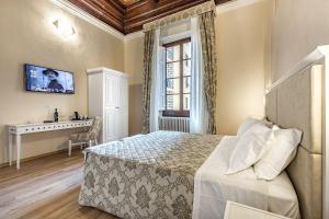 Postel nebo postele na pokoji v ubytování Residenza Alessandra