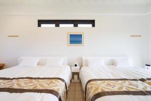 Tempat tidur dalam kamar di Sunset Hill Ishigaki