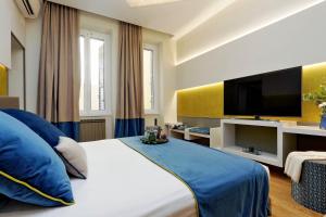 Cama ou camas em um quarto em Colonna 32