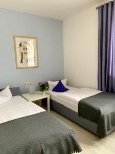 Postel nebo postele na pokoji v ubytování Art Hotel Köln