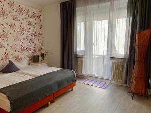 Postel nebo postele na pokoji v ubytování Art Hotel Köln