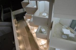 an overhead view of a living room with white furniture at QuiHotel in Porto Cesareo