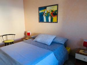 A bed or beds in a room at Ambrosia