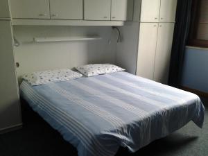 A bed or beds in a room at Le Magnolie B&B