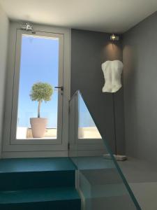 תמונה מהגלריה של Unìco Boutique Hotel d'Arte במונדלו