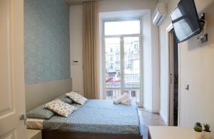 Кровать или кровати в номере Garibaldi Rooms