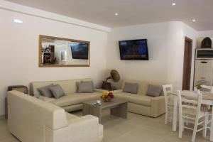 a living room with a couch and a table at Kristi Apartments in Hersonissos