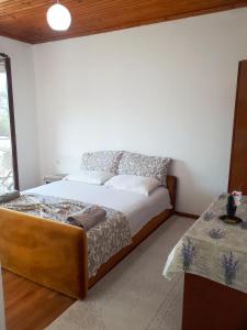 Voodi või voodid majutusasutuse Guesthouse DONA toas