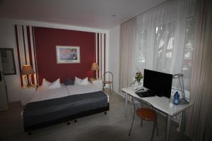 Postel nebo postele na pokoji v ubytování Art Hotel Köln