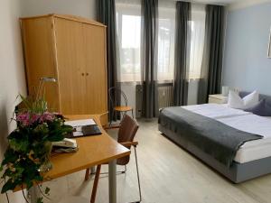 Postel nebo postele na pokoji v ubytování Art Hotel Köln
