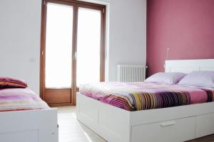 Postel nebo postele na pokoji v ubytování Casa dei Nonni #charminglanga
