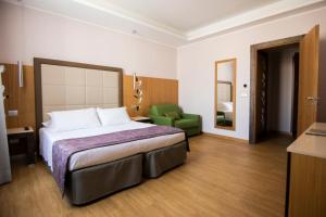 Cama ou camas em um quarto em Hotel Giolli Nazionale
