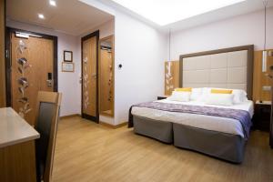 Cama ou camas em um quarto em Hotel Giolli Nazionale