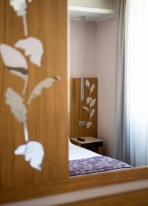 Cama ou camas em um quarto em Hotel Giolli Nazionale