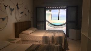 Postel nebo postele na pokoji v ubytování NUMAR Hotel