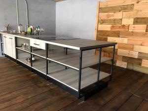 a kitchen island with a counter top in a room at Veranda Guest House in Chornomorsk