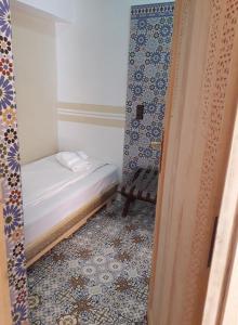 Cama o camas de una habitación en Dar El Jadida