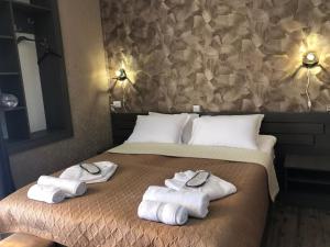 A bed or beds in a room at Paradise Kazbegi