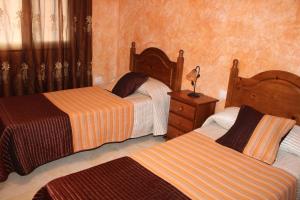 A bed or beds in a room at Apartamento Delgado y Ruiz