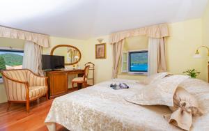 TV a/nebo společenská místnost v ubytování Hotel Ostrea