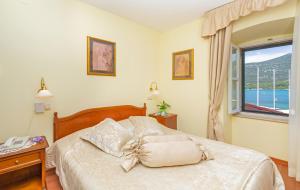 Postel nebo postele na pokoji v ubytování Hotel Ostrea
