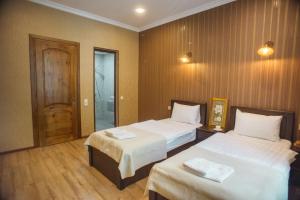 Katil atau katil-katil dalam bilik di Hotel Almi