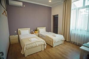 Katil atau katil-katil dalam bilik di Hotel Almi
