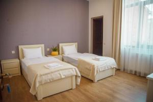 Katil atau katil-katil dalam bilik di Hotel Almi
