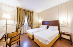 Postel nebo postele na pokoji v ubytování The Regency Sure Hotel Collection by Best Western