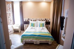 Postel nebo postele na pokoji v ubytování Hotel Carpe Diem
