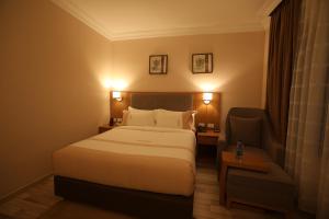 Postel nebo postele na pokoji v ubytování Mado Hotel