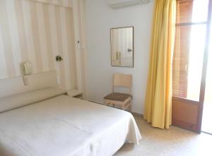 Postel nebo postele na pokoji v ubytování Hotel Tramontana