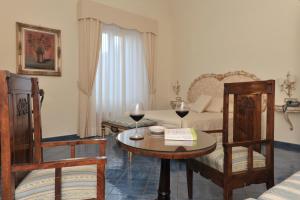 Postel nebo postele na pokoji v ubytování Hotel Santa Lucia