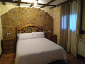 A bed or beds in a room at Apartamentos Turisticos Julia