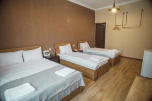 Katil atau katil-katil dalam bilik di Hotel Almi