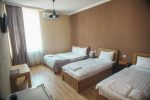 Katil atau katil-katil dalam bilik di Hotel Almi