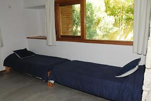 Una cama o camas en una habitación de Cabañas San Dionisio