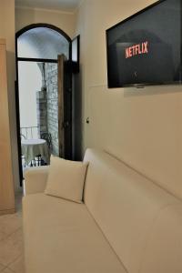 TV a/nebo společenská místnost v ubytování Camere Santa Chiara